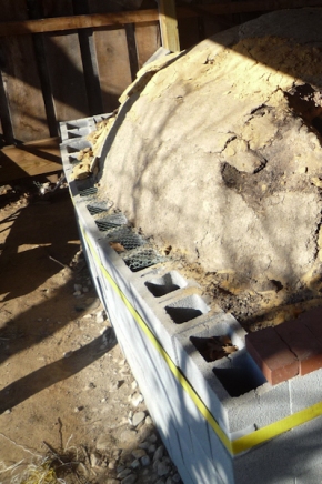Unmortared foundation wall bowing outward